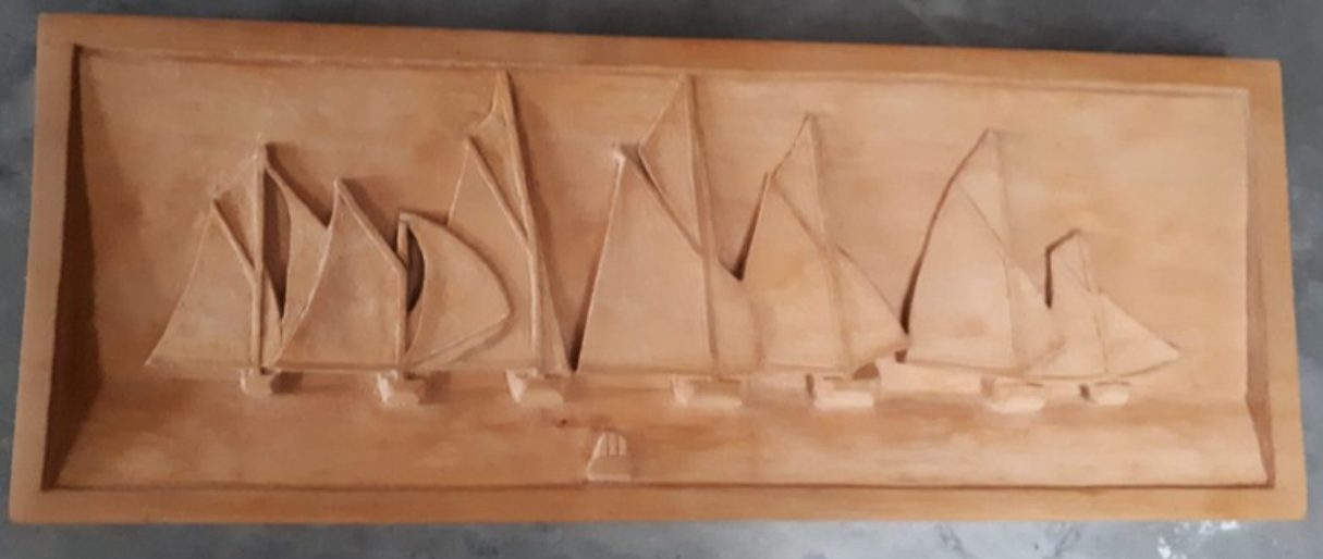 Relief carving of sailing boats