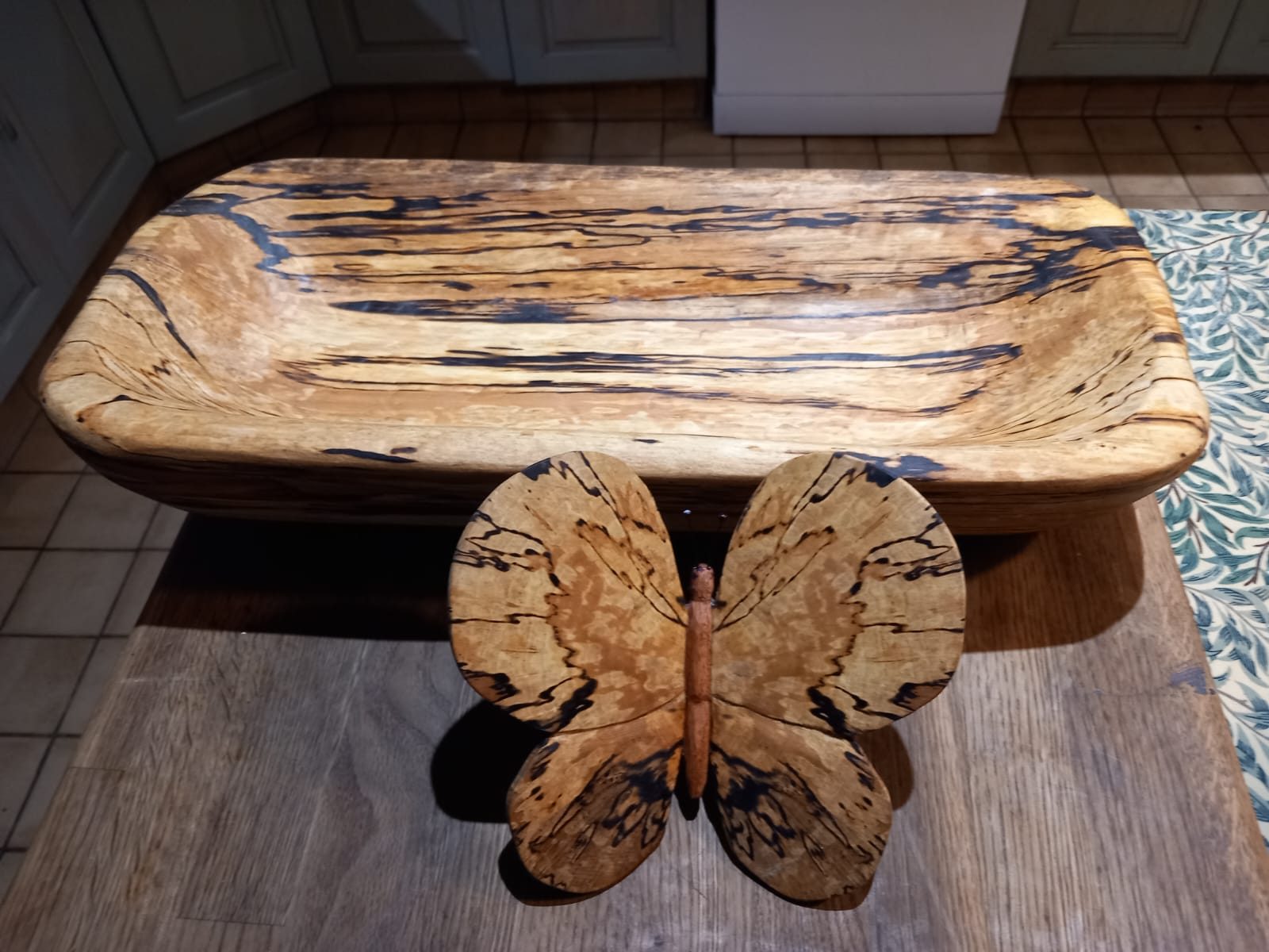 Spalted wooden bowl with a matching butterfly