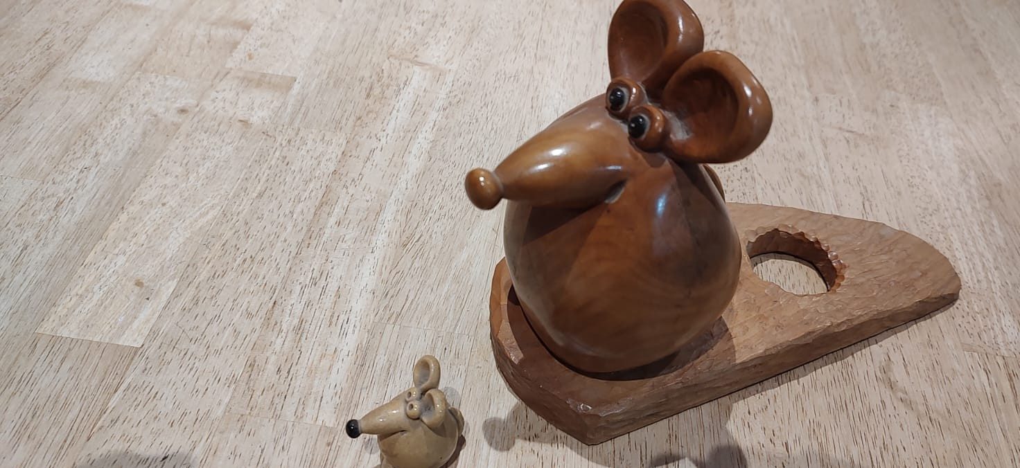 Two carved mice, one large and one small