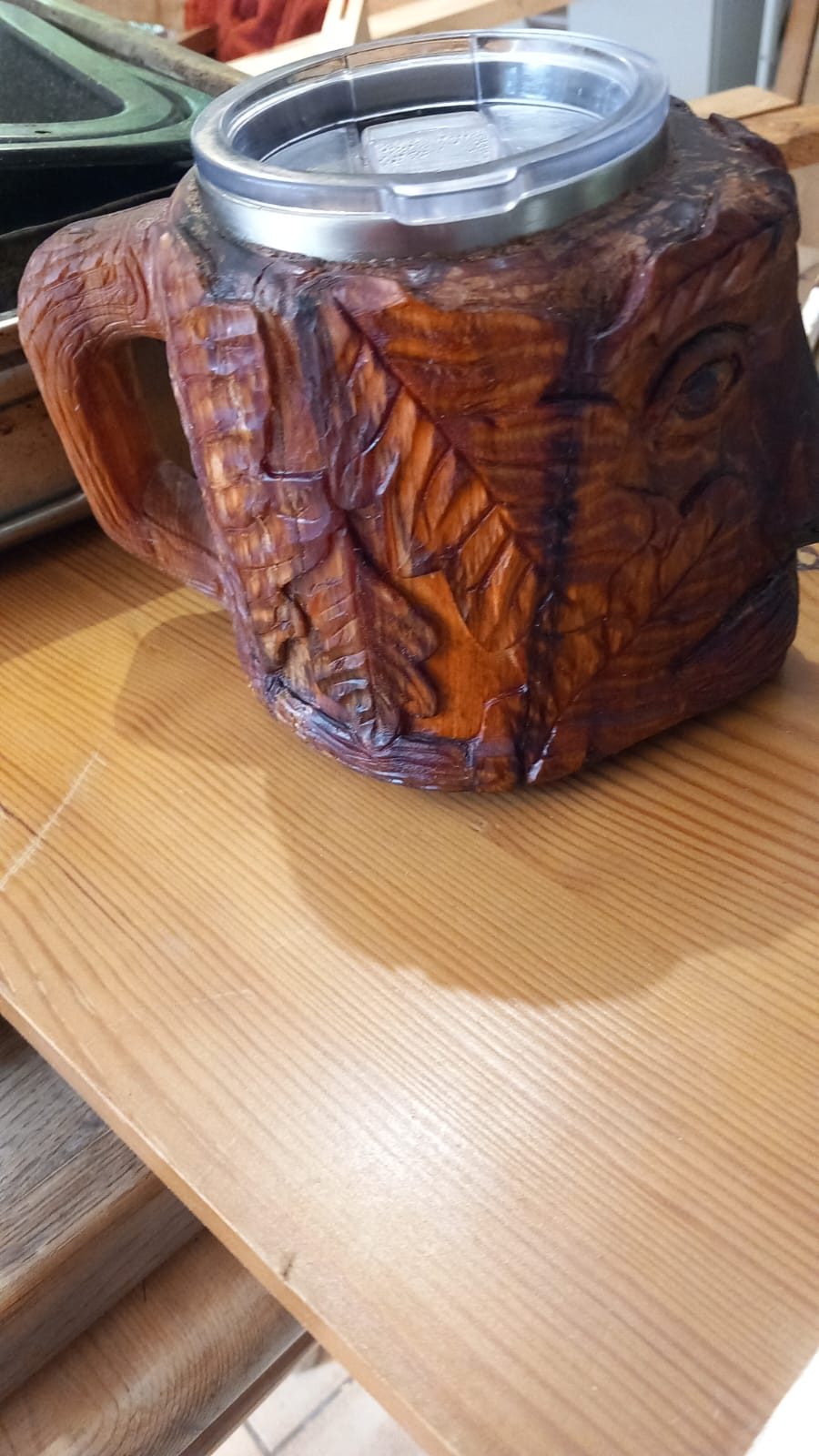 Carved wooden tankard with leaf decoration